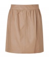 Stylish, lightly pleated skirt in supple, genuine leather - Chic, on-trend macchiato color - Banded waist and back zip - Slim, flattering cut hits above the knee - Ideal for both day and evening - Go for a casual look with a white button down or cashmere pullover and ballet flats - Dress up with a silk top, blazer and platform booties