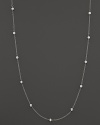 Diamond stations shine on an elegant white gold necklace.