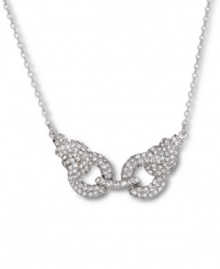 Arrestingly alluring. Adorned with clear crystals, Swarovski's handcuff pendant necklace conveys edgy glamour. Made in silver tone mixed metal, its clasp closure includes three settings. Approximate length: 15 inches. Approximate drop: 1 inch. Arrestingly alluring. Adorned with clear crystals, Swarovski's handcuff pendant necklace conveys edgy glamour. Made in silver tone mixed metal, its clasp closure includes three settings. Approximate length: 15 inches. Approximate drop: 1 inch.