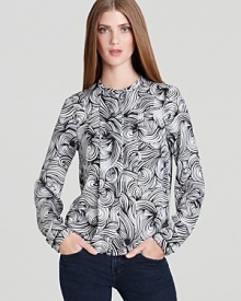 A retro-inspired print imbues this DIANE von FURSTENBERG top of luxe silk with vintage charm.