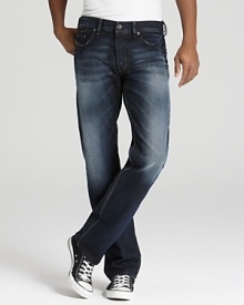 A relaxed fit jean with a deep blue rinse and contrast sandblast fading along the leg and seat. A relaxed fit jean with a deep blue rinse and contrast sandblast fading along the leg and seat.