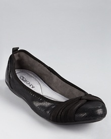 A knotted detail at the toe lends a graceful touch to DKNY's city-chic Sophie ballet flats.