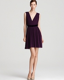 Ignite your cocktail attire in this DKNY dress, ablaze with a vibrant jewel tone. Play up the pleated silhouette with polished pumps for a ladylike statement.