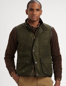 Utility pockets and a rugged oilcloth construction imbue this vest with an authentic look and feel.Full-zip frontSnap button placketStand collarChest slash, waist flap pocketsAbout 27 from shoulder to hemCottonDry cleanImported Utility pockets and a rugged oilcloth construction imbue this vest with an authentic look and feel.Full-zip frontSnap button placketStand collarChest slash, waist flap pocketsAbout 27 from shoulder to hemCottonDry cleanImported