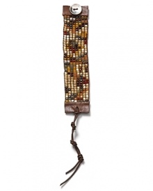 In an eclectic mix of semiprecious stones, Chan Luu's leather cuff is a bohemian essential. Come fall, layer yours over lush knits to channel this season's textured take on hippie glamour. In an eclectic mix of semiprecious stones, Chan Luu's leather cuff is a bohemian essential. Come fall, layer yours over lush knits to channel this season's textured take on hippie glamour.