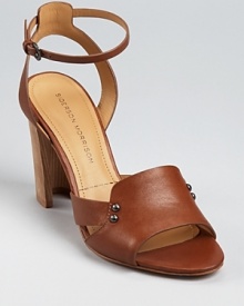On Sigerson's Morrison Bunch sandals, all eyes are on the heel--a stacked construction is scooped out, creating a concave silhouette that feels fresh and utterly unique. On Sigerson's Morrison Bunch sandals, all eyes are on the heel--a stacked construction is scooped out, creating a concave silhouette that feels fresh and utterly unique.