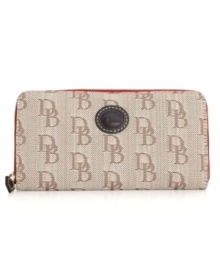 Dooney & Bourke offers a demure display of signature practicality with this classic wallet. Featuring the iconic emblem and signature jacquard exterior, this wallet will seamlessly carry over from season to season. Dooney & Bourke offers a demure display of signature practicality with this classic wallet. Featuring the iconic emblem and signature jacquard exterior, this wallet will seamlessly carry over from season to season.