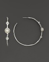 Three mother-of-pearl cabochons, set in sterling silver hoop earrings.