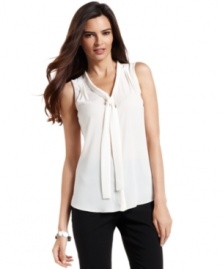 Alfani's petite blouse features a sophisticated tie-neck and chic graphic-print -- perfect from desk to dinner!