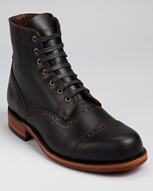 The classic Frye boot, a bold cap toe affair with perforated wingtip accents and a tough leather and rubber outsole The classic Frye boot, a bold cap toe affair with perforated wingtip accents and a tough leather and rubber outsole