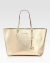 A simply chic style in metallic coated canvas, perfectly sized for traveling with your essentials.Double top handles, 8 dropHook and strap closureOne inside zip pocketOne inside open pocket14½W X 11½H X 6½DImported