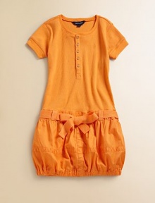 Her favorite cotton Henley tee is transformed into a playful daytime dress with a drop waist and a skirt for a military-inspired look.Ribbed crewneckShort sleeves with ribbed cuffsFront button placketSmall cargo pockets at chestElasticized drop-waist with self-tie beltBubble skirtElastic hemCottonMachine washImported Please note: Number of buttons may vary depending on size ordered. Her favorite cotton Henley tee is transformed into a playful daytime dress with a drop waist and a skirt for a military-inspired look.Ribbed crewneckShort sleeves with ribbed cuffsFront button placketSmall cargo pockets at chestElasticized drop-waist with self-tie beltBubble skirtElastic hemCottonMachine washImported Please note: Number of buttons may vary depending on size ordered.