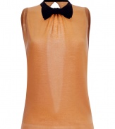 Detailed with a cute bowtie and sultry open back, Moschino C&Cs apricot sleeveless knit top is a fun feminine choice for dressing up your look - Short stand-up collar with black satin trim and bowtie, sleeveless, fine ribbed trim, slit back, snap closures at the nape - Fitted - Wear with figure-hugging separates and platform peep-toes
