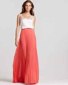 Rendered in a statement-making hue, this immaculately tailored Halston Heritage maxi skirt boasts fine pleating for sweeping elegance. Rendered in a statement-making hue, this immaculately tailored Halston Heritage maxi skirt boasts fine pleating for sweeping elegance.