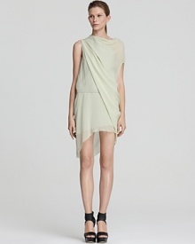 An ethereal Helmut Lang dress flaunts a Grecian-like aesthetic with lofty draped layers that float over your silhouette. Modern and feminine at the same time, this is a piece to own and adore. An ethereal Helmut Lang dress flaunts a Grecian-like aesthetic with lofty draped layers that float over your silhouette. Modern and feminine at the same time, this is a piece to own and adore.