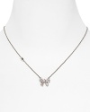 Tie on sweet sparkle with this delicate crystal bow necklace from Juicy Couture, sure to be on every girl's wish list.