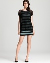 Rock the layered look in this Bailey 44 dress, featuring a mesh overlay and boldly striped underlay.