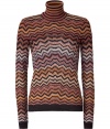 Eye-catching sweater from fashion label Missoni in super trendy 1970s colors - Features iconic Missoni zigzag pattern - Cut with a high turtleneck and fitted long sleeves with contrasting cuffs and hem - Pair for the office with a pencil skirt or with gold jewelry, wide-legged trousers and platform heels for the boho-look, or simply with jeans for everyday style