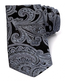Paisley flourishes across this silk tie for a look that's boldly classic. Paisley flourishes across this silk tie for a look that's boldly classic.