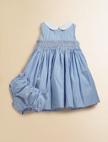 An essential warm-weather dress in crisp cotton poplin is the epitome of adorably polished style with a Peter Pan collar, smocked yoke and pretty bow tie.Peter Pan collarSleevelessBack embossed pearlized buttonsSmocked front yoke with embroidered rosette detailsSelf-tie sash waistbandSweeping flared skirtFully lined slip with tiered rufflesMatching bloomersCottonMachine washImported An essential warm-weather dress in crisp cotton poplin is the epitome of adorably polished style with a Peter Pan collar, smocked yoke and pretty bow tie.Peter Pan collarSleevelessBack embossed pearlized buttonsSmocked front yoke with embroidered rosette detailsSelf-tie sash waistbandSweeping flared skirtFully lined slip with tiered rufflesMatching bloomersCottonMachine washImported