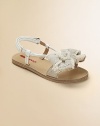 Patent leather with linen fringe bow detail.Adjustable ankle strap with grip-tape closure Leather sole Imported