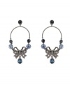 Out of the blue. Beautiful blue crystals further enhance the elegance of Betsey Johnson's stunning chandelier earrings. Featuring a delicate bow motif, they're crafted in hematite tone mixed metal. Approximate drop: 3-3/10 inches.