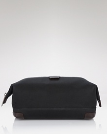A simple, chic travel kit with top zip closure, contrast trim and logo detail. A simple, chic travel kit with top zip closure, contrast trim and logo detail.