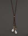 Boldly gleaming baroque freshwater pearls add rich luster to 14K yellow gold and leather. By Nancy B.