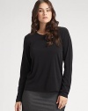 Lightweight and luxurious, this fine silk top can be layered or worn alone. Crew neckline Hand wash Imported