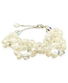 Go for a subtle hint of shimmer, or a standout look. This beautiful bracelet highlights cultured freshwater pearls and sparkling Swarovski crystal accents. Set in sterling silver. Approximate length: 6-1/4 inches + 2-inch extender. Go for a subtle hint of shimmer, or a standout look. This beautiful bracelet highlights cultured freshwater pearls and sparkling Swarovski crystal accents. Set in sterling silver. Approximate length: 6-1/4 inches + 2-inch extender.