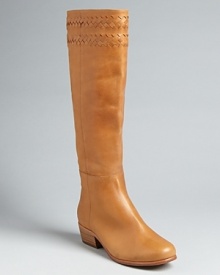 In a cleanly designed take on the Western trend, these Joie tall boots are finished up with woven details up top. In a cleanly designed take on the Western trend, these Joie tall boots are finished up with woven details up top.