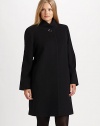 Simply elegant and made from fine Italian fabrication, a stand-collar coat with classic princess seams, convenient pockets and a universally flattering A-line silhouette.Button closure at stand collarPrincess seamsSlash pocketsFully linedAbout 36 from shoulder to hemWool/angora/nylonDry cleanImported of Italian