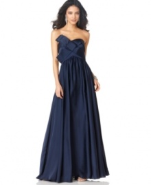 Make a glamorous style statement in this strapless evening gown from JS Collection.