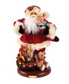 Looking ever-so-handsome, this traditional Santa Claus figurine by Christopher Radko is beautifully dressed in his holiday best and carrying a stocking-full of gifts. With a satchel of toys at his feet and extraordinary detail for a feeling of warmth and good cheer.