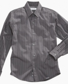 Keep it fresh. This Calvin Klein button-up shirt puts a cool look within reach in his closet.