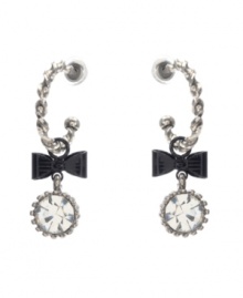 Chic hoops with an extra touch of flirtation. Betsey Johnson earrings feature quarter hoops decorated with bow and round-cut crystal charms. Crafted in silver tone mixed metal. Approximate drop: 2 inches.