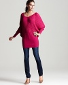 The season's texture trend is realized in this vibrant Trina Turk ribbed sweater--loose at the bodice and fitted at the hips. Accented at the back with a chic tie, this retro style is the update your knits have been needing.