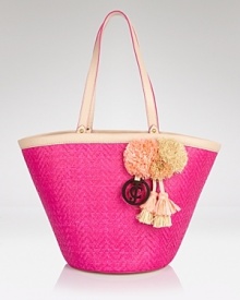 Give looks a rah-rah-resort-inspired spin with this straw tote from Juicy Couture. Playful pom-poms and a punchy hue make this a cheery vacation companion. Give looks a rah-rah-resort-inspired spin with this straw tote from Juicy Couture. Playful pom-poms and a punchy hue make this a cheery vacation companion.
