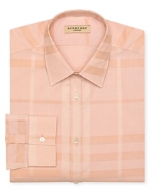 Patterned with a larger-than-life signature check design, this Burberry London dress shirt opens the day with iconic style. Patterned with a larger-than-life signature check design, this Burberry London dress shirt opens the day with iconic style.