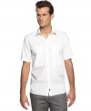 Work your weekend look with extra polish wearing this short-sleeved shirt from Calvin Klein.