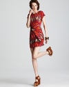Incorporate the tribal trend into your daily rotation with this MICHAEL Michael Kors dress. A strikingly oversized print lends vivid impact to the city-chic silhouette.