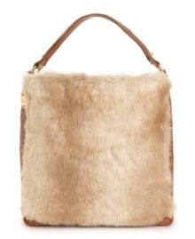 Fur-ociously trendy and detailed with antique goldtone studs, the Ginger tote perfectly marries now and then. Fur-ociously trendy and detailed with antique goldtone studs, the Ginger tote perfectly marries now and then.
