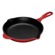 For nearly a century, Le Creuset has handcrafted enameled cast iron cookware of superlative quality, durability and versatility and this skillet is no different. Crafted with a cast iron exterior for uniform heating and a black enamel interior to seal in juices, this easy-to-grip pan expertly cooks restaurant-quality fare including frittatas and omelets in no time while dual pour spouts accommodate right or left-handers. For nearly a century, Le Creuset has handcrafted enameled cast iron cookware of superlative quality, durability and versatility and this skillet is no different. Crafted with a cast iron exterior for uniform heating and a black enamel interior to seal in juices, this easy-to-grip pan expertly cooks restaurant-quality fare including frittatas and omelets in no time while dual pour spouts accommodate right or left-handers.