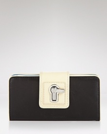 Juicy Couture puts a practical spin on the color block trend with this leather wallet. A turn lock closure lends this piece a final stamp of chic. Juicy Couture puts a practical spin on the color block trend with this leather wallet. A turn lock closure lends this piece a final stamp of chic.