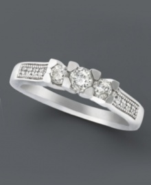 A stunning engagement ring with a modern twist. A three stone diamond design (1/2 ct. t.w.) complemented by round-cut diamond side stones shines in a 14k white gold setting. A stunning engagement ring with a modern twist. A three stone diamond design (1/2 ct. t.w.) complemented by round-cut diamond side stones shines in a 14k white gold setting.