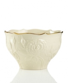 With lush roses and delicate dots carved in ivory porcelain, this classic bowl is a fine caddy for sweet treats. A scalloped, gold-tipped rim adds an element of grandeur to any tabletop. Qualifies for Rebate