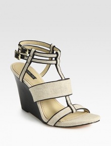 Textured linen t-strap design with leather trim, adjustable ankle straps and a stacked wedge. Stacked wedge, 4 (100mm)Linen and leather upperLeather lining and solePadded insoleImportedOUR FIT MODEL RECOMMENDS ordering true size. 