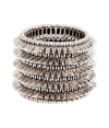 Add a kick of cool to any outfit with Philippe Audiberts edgy spiked cuff bracelet - Slips on, elasticized, engraved logo charm - Wear with a simple jeans and tee ensemble, or dress up with cocktail frocks and just as sparkly accessories