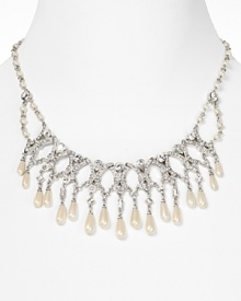 Trimmed in glittering pearls, Carolee's crystal bib enlivens any neckline. After dark, wear it with a scoopneck tee to make an easy favorite look elegant.