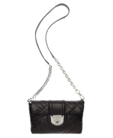 Diamond-quilted in super-soft lamb leather, this convertible purse by Calvin Klein turns heads (and turns into a clutch). Diamond-quilted in super-soft lamb leather, this convertible purse by Calvin Klein turns heads (and turns into a clutch).